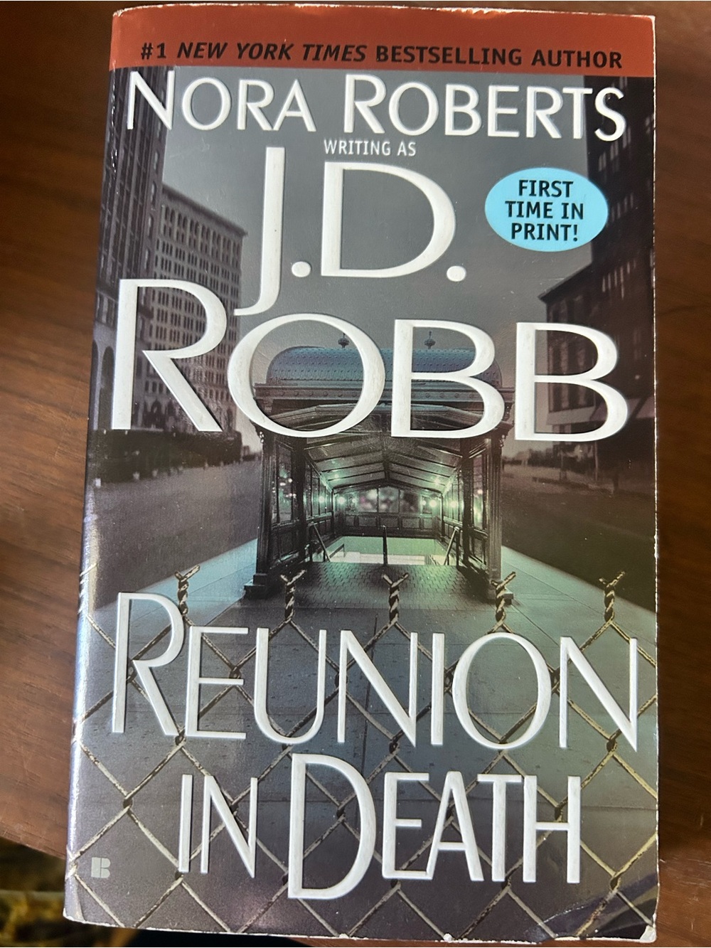Reunion in Death by J.D. Robb — Paperback Book, Teal & Gray Cover